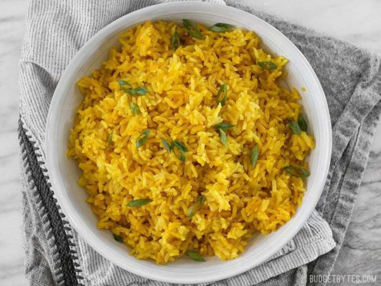 Yellow Rice in bowl garnished with cilantro