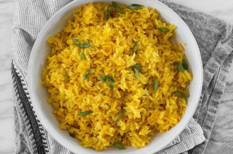 Yellow Rice in bowl garnished with cilantro